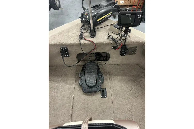 Slide: The Image of 2006 Lowe Fish & Ski 175 boat interior with trolling motor and fish finder. - 34