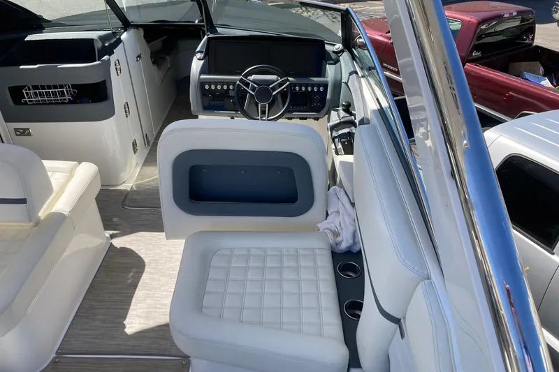 Slide: The Image of Interior of a 2022 Cobalt R30 boat with modern dashboard and seating. - 10