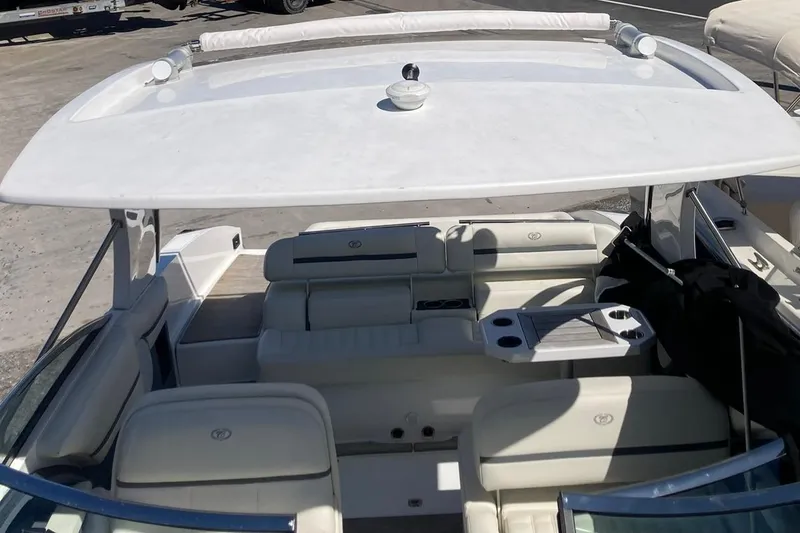 Slide: The Image of 2022 Cobalt R30 boat interior with white seating and spacious layout. - 12