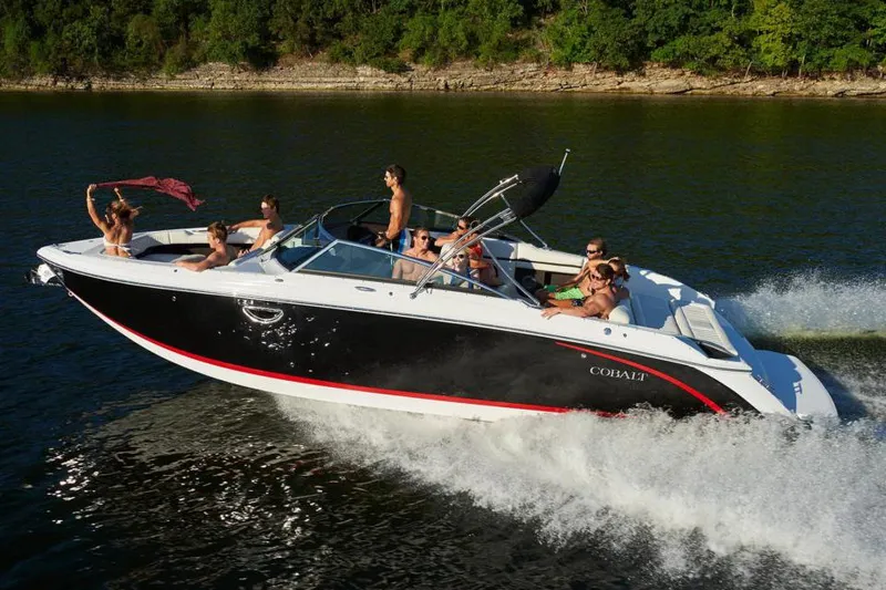 Slide: The Image of Manufacturer Provided Image: 2022 Cobalt R30 boat cruising on a lake with passengers enjoying the ride. - 34