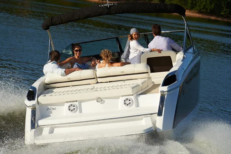 Slide: The Image of Manufacturer Provided Image: 2022 Cobalt R30 boat cruising with passengers on a sunny day. - 36