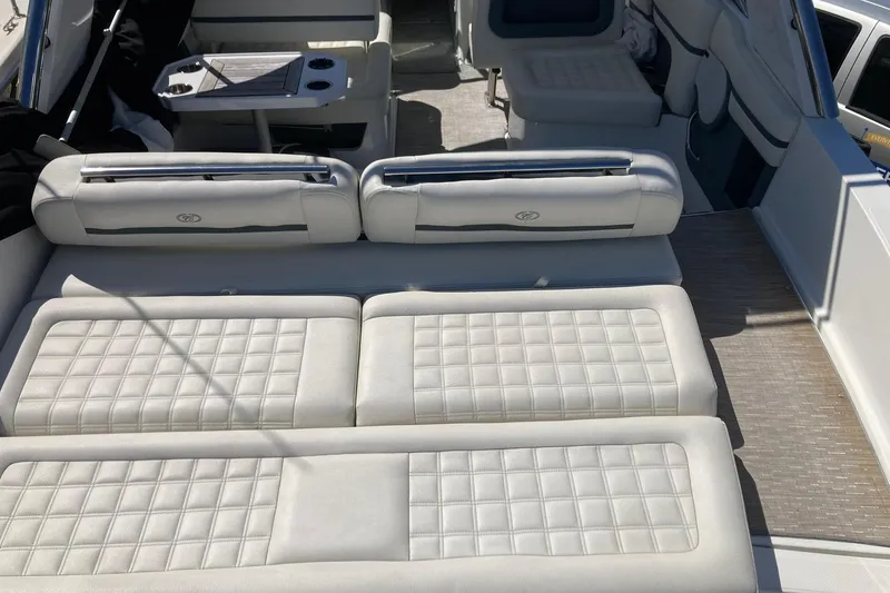 Slide: The Image of Luxurious seating on 2022 Cobalt R30 boat with quilted upholstery and table. - 5