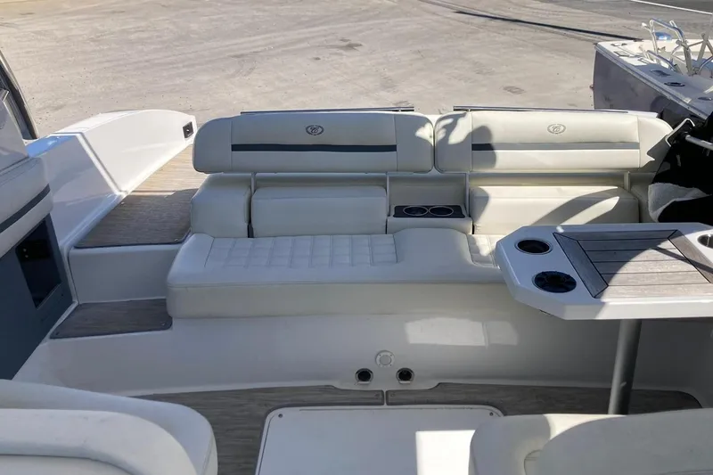 Slide: The Image of Interior of a 2022 Cobalt R30 boat with seating area and table. - 6