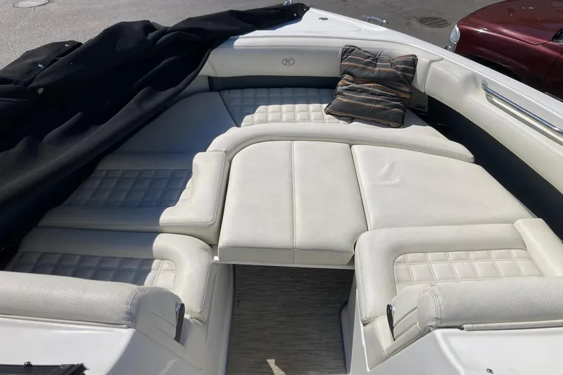 Slide: The Image of Luxurious seating area on a 2022 Cobalt R30 boat with cushions and cover. - 8