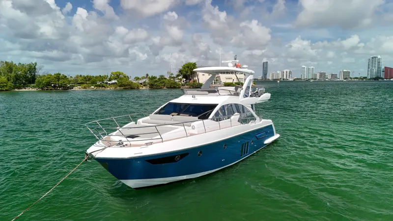 Slide: The Image of Azimut 50 Flybridge 2016 yacht on water with city skyline background. - 10