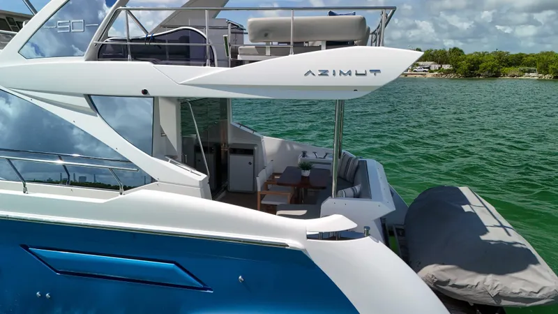 Slide: The Image of Azimut 50 Flybridge 2016 yacht on water, featuring sleek design and spacious deck. - 24