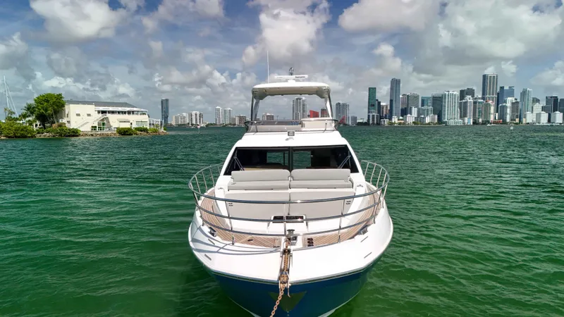 Slide: The Image of 2016 Azimut 50 Flybridge yacht on water with city skyline in background. - 29