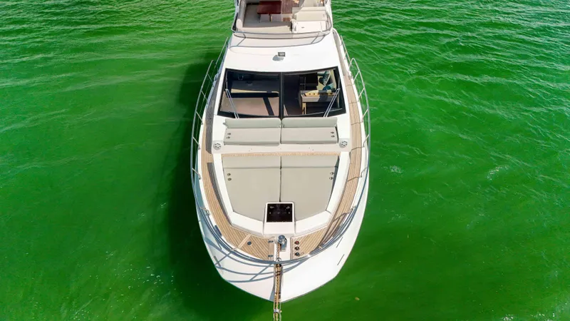 Slide: The Image of Aerial view of 2016 Azimut 50 Flybridge yacht on vibrant green water. - 32