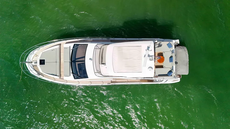 Slide: The Image of Overhead view of 2016 Azimut 50 Flybridge yacht on green water. - 36