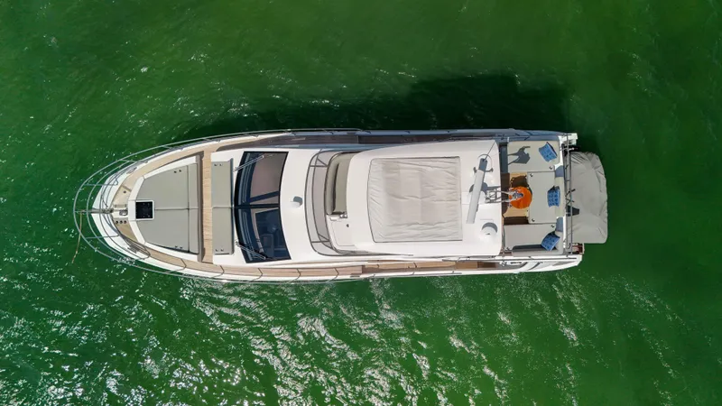 Slide: The Image of Overhead view of 2016 Azimut 50 Flybridge yacht on green water. - 37