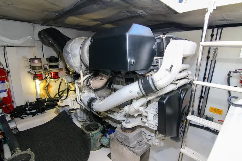 Slide: The Image of Engine room of 2016 Azimut 50 Flybridge yacht, featuring mechanical components and safety equipment. - 40