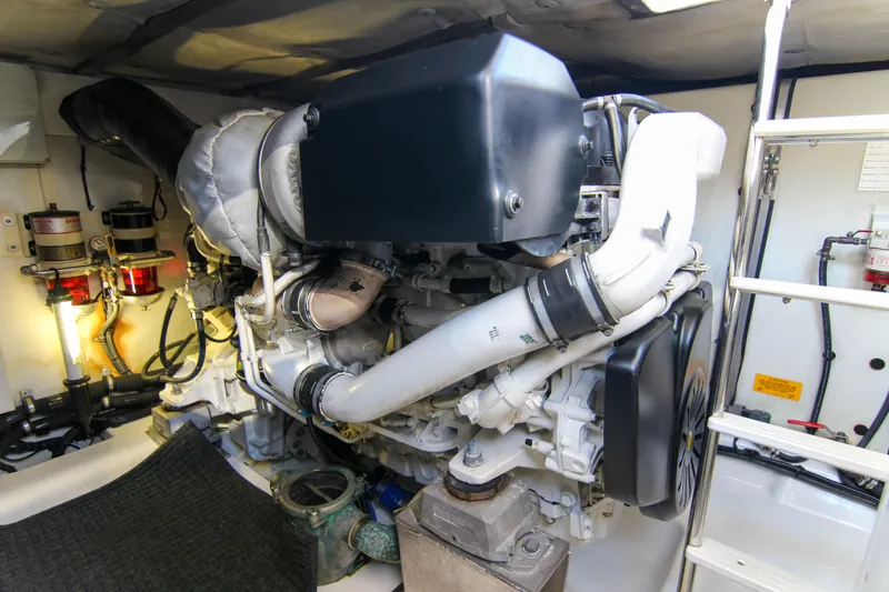 Slide: The Image of Engine room of 2016 Azimut 50 Flybridge yacht, showcasing mechanical components and systems. - 41