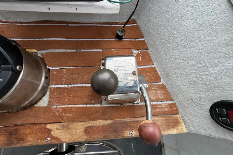 Slide: The Image of Marine throttle control on a 2007 Northern Bay 36 boat, mounted on a wooden panel. - 18