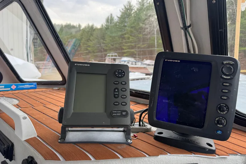 Slide: The Image of Navigation equipment on a 2007 Northern Bay 36 boat dashboard, featuring Furuno displays. - 19