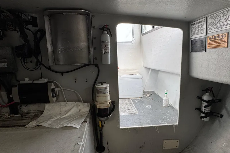 Slide: The Image of Interior of a 2007 Northern Bay 36 boat, featuring equipment and safety notices. - 30