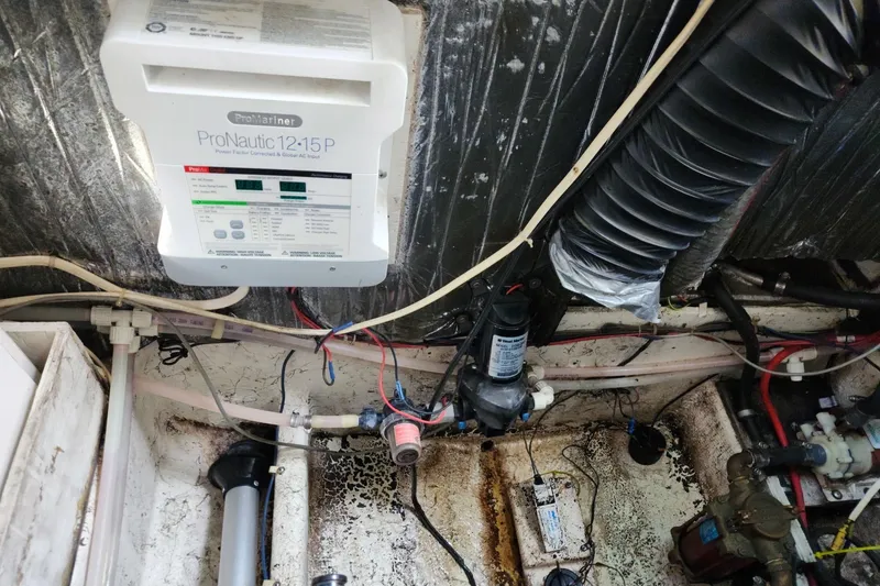 Slide: The Image of Engine compartment of a 1997 Maxum 2700 SCR boat with ProMariner ProNautic charger. - 22