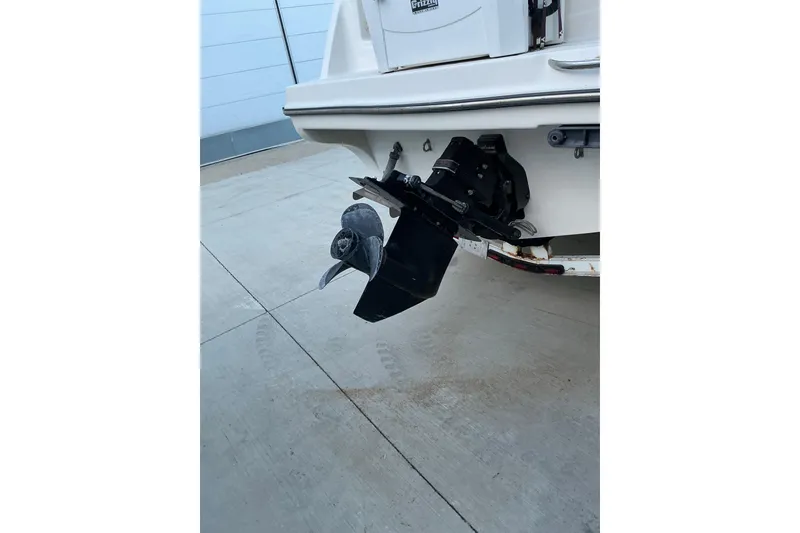Slide: The Image of 1997 Maxum 2700 SCR boat stern with propeller and outdrive visible. - 5