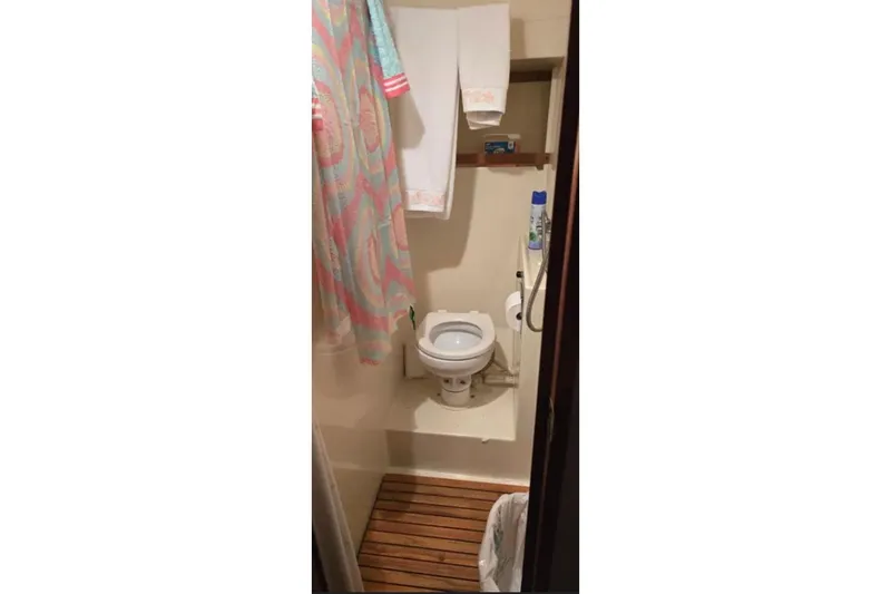 Slide: The Image of Bathroom interior of 1987 Chris-Craft 427 Catalina yacht with wooden flooring. - 16