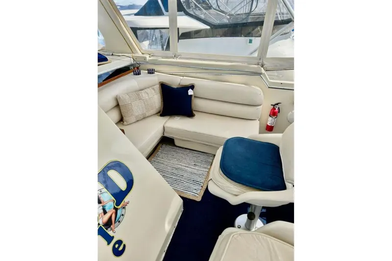 Slide: The Image of Interior of 1987 Chris-Craft 427 Catalina yacht with beige seating and nautical decor. - 6