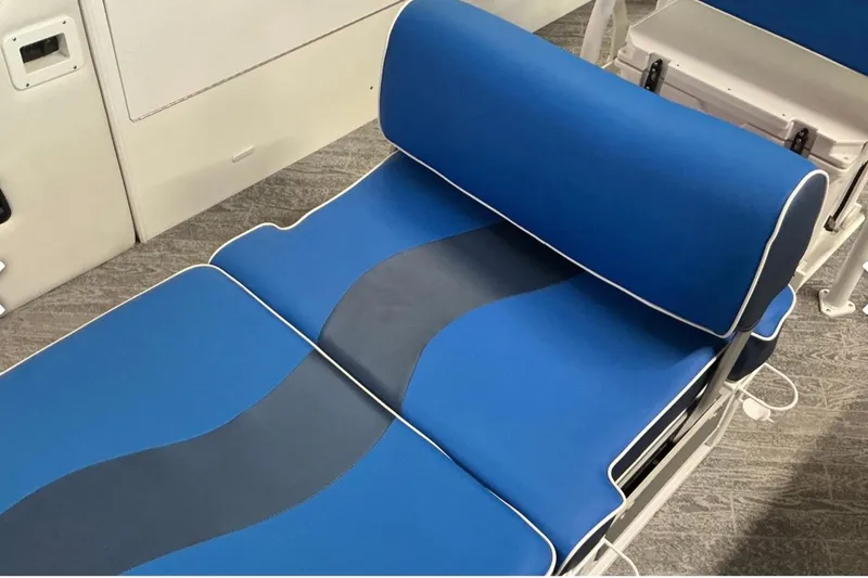 Slide: The Image of Blue cushioned seating on 2025 JC SportAngler 26TT HTH boat, featuring sleek design and comfort. - 12