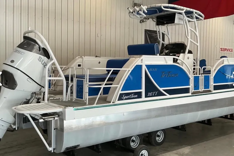 Slide: The Image of 2025 JC SportAngler 26TT HTH pontoon boat with Suzuki 350 outboard motor in showroom. - 4