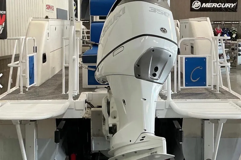 Slide: The Image of 2025 JC SportAngler 26TT HTH boat with Suzuki 350 outboard motor in showroom. - 9