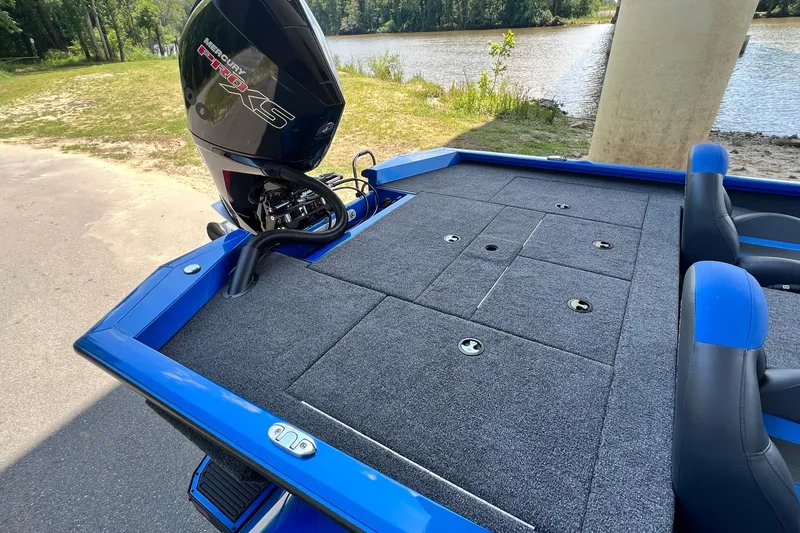 Slide: The Image of 2022 Vexus AVX 2080 boat with Mercury Pro XS engine, parked near a lake. - 10