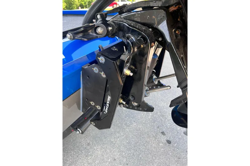 Slide: The Image of Close-up of 2022 Vexus AVX 2080 boat motor mount and steering mechanism. - 13