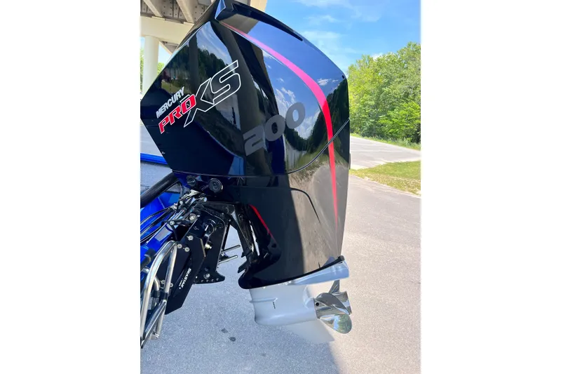 Slide: The Image of 2022 Vexus AVX 2080 with Mercury Pro XS 200 engine, parked outdoors. - 14