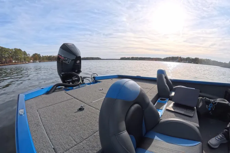 Slide: The Image of 2022 Vexus AVX 2080 boat on a lake, featuring a Mercury engine and comfortable seating. - 5