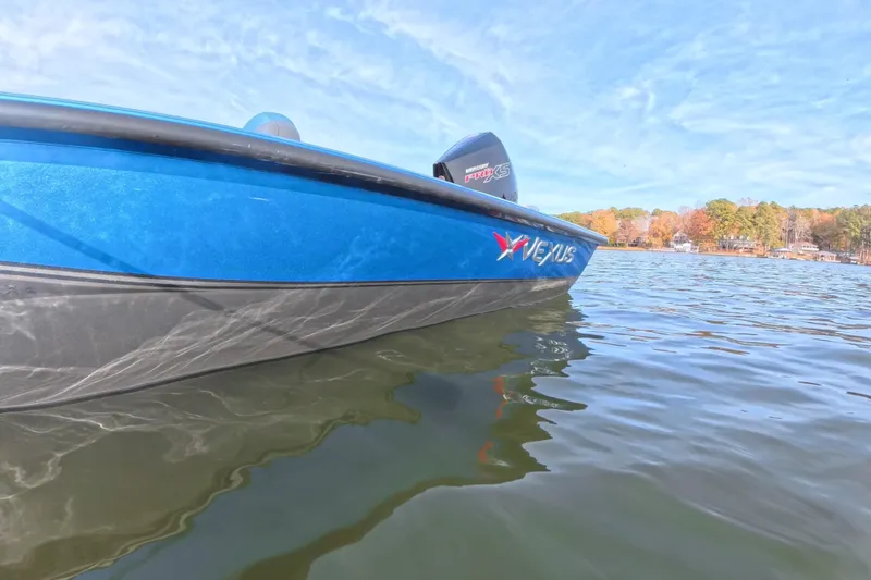 Slide: The Image of 2022 Vexus AVX 2080 boat on a serene lake with autumn trees in the background. - 7