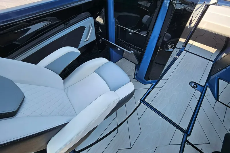 Slide: The Image of Interior of 2023 Yamaha Boats 255XD, featuring sleek seating and modern design elements. - 11