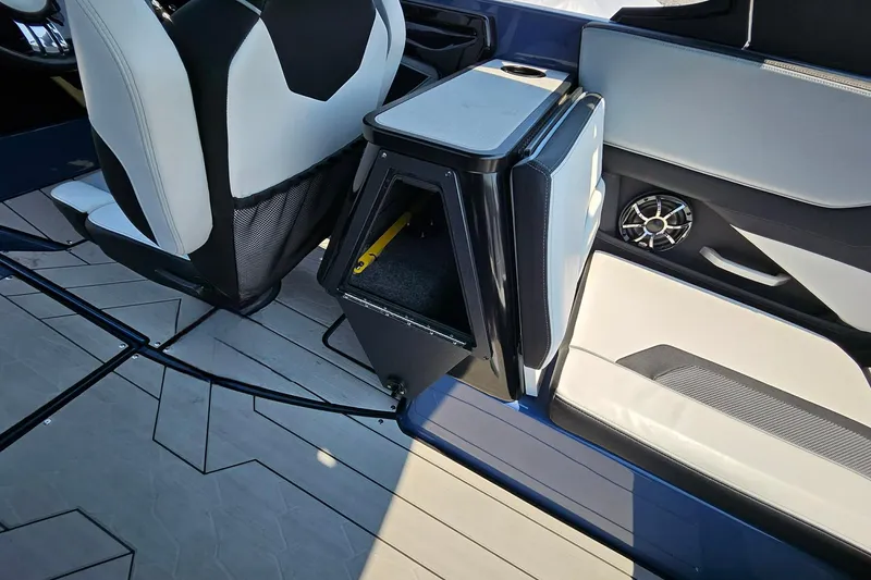 Slide: The Image of Interior of 2023 Yamaha Boats 255XD, featuring seating and storage compartment. - 17