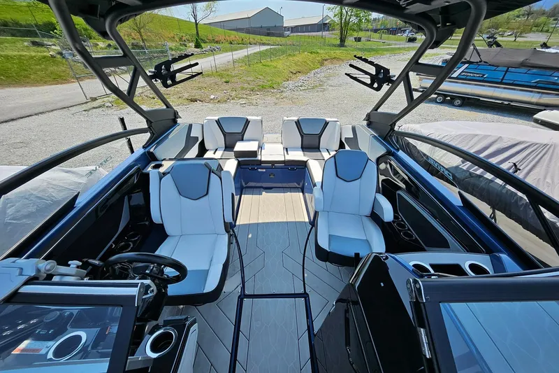 Slide: The Image of 2023 Yamaha Boats 255XD interior with sleek seating and modern dashboard design. - 18