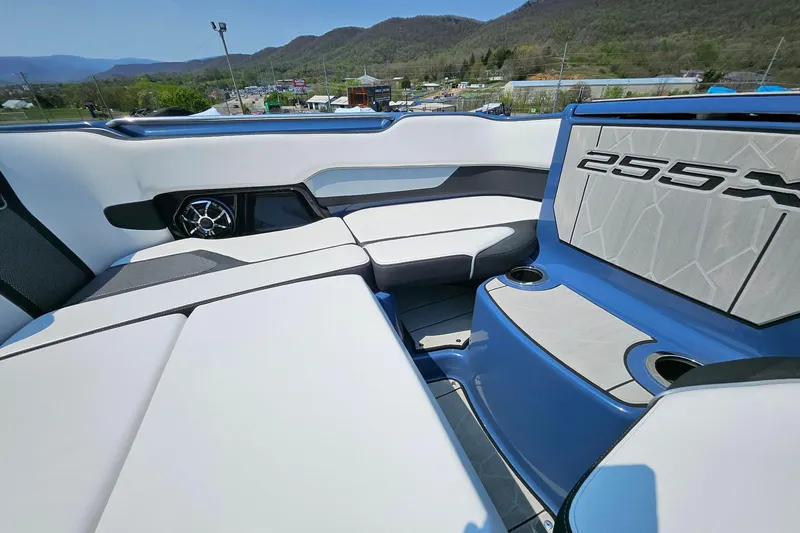 Slide: The Image of Interior of 2023 Yamaha Boats 255XD, featuring sleek seating and modern design. - 19