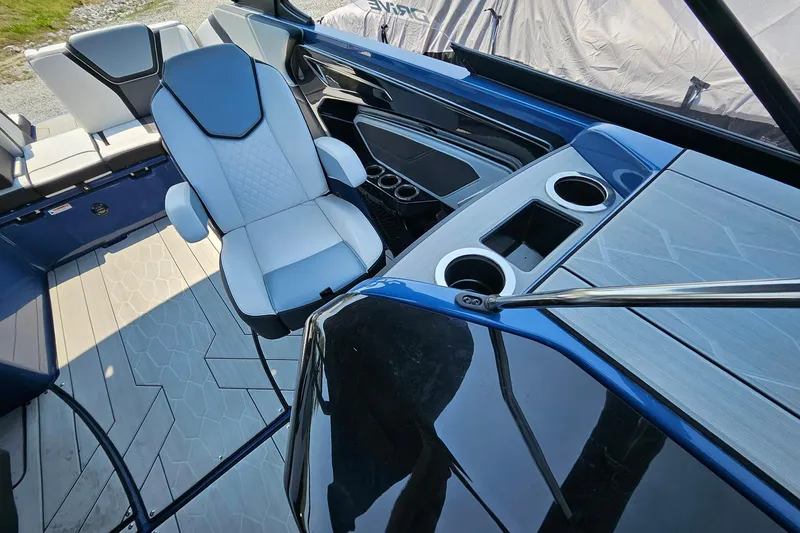 Slide: The Image of Interior of 2023 Yamaha Boats 255XD, featuring sleek seating and modern design elements. - 9