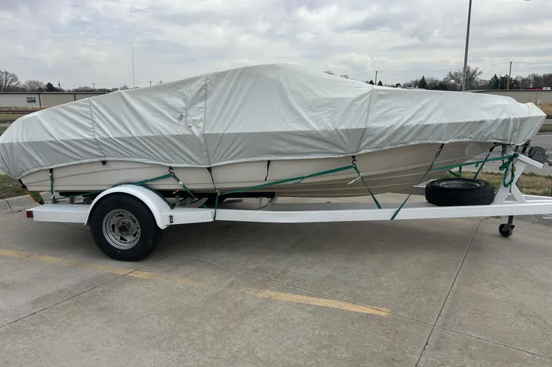 Slide: The Image of Covered 1996 Mariah 180 Shabah boat on trailer in parking lot. - 10