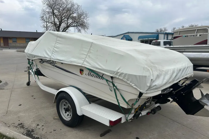 Slide: The Image of Covered 1996 Mariah 180 Shabah boat on trailer in parking lot. - 11
