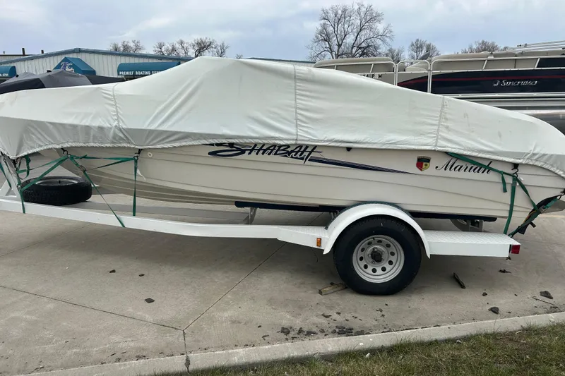 Slide: The Image of Covered 1996 Mariah 180 Shabah boat on trailer, parked outdoors. - 12