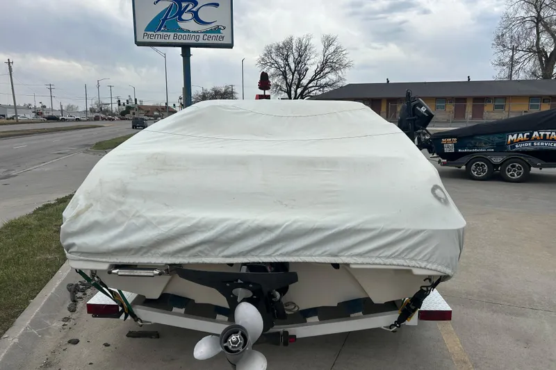 Slide: The Image of Covered 1996 Mariah 180 Shabah boat at Premier Boating Center parking lot. - 14