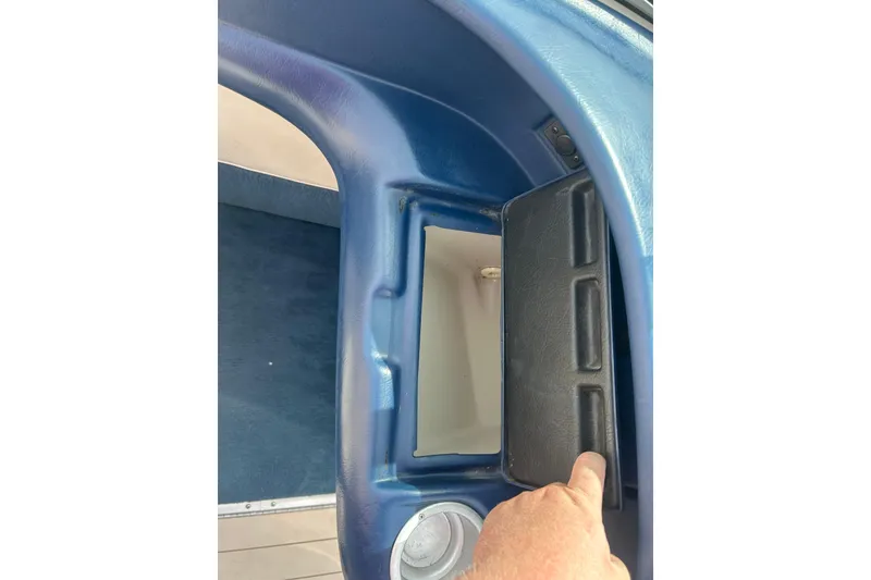 Slide: The Image of Interior compartment of a 1996 Mariah 180 Shabah boat with blue and black detailing. - 20