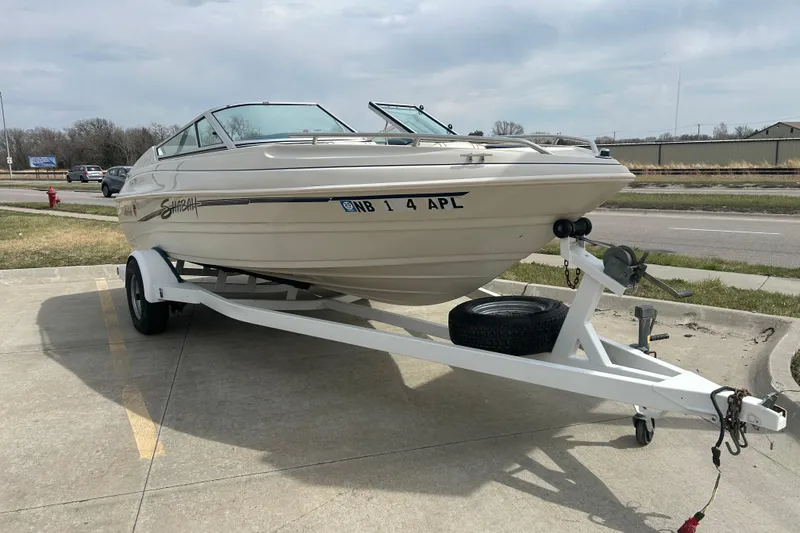 Slide: The Image of 1996 Mariah 180 Shabah boat on trailer in parking lot. - 4