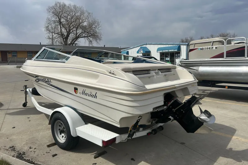 Slide: The Image of 1996 Mariah 180 Shabah boat on trailer in a parking lot. - 5