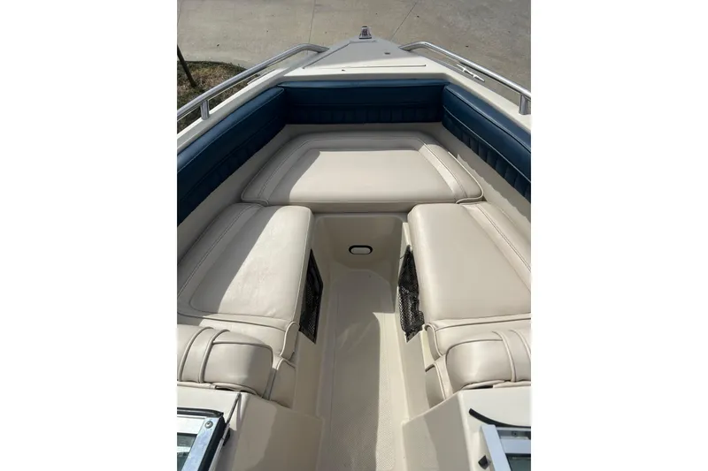 Slide: The Image of 1996 Mariah 180 Shabah boat interior with beige and blue seating. - 7
