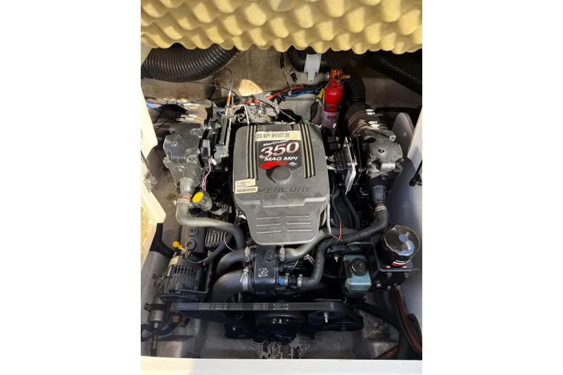 Slide: The Image of Engine of 2005 Sea Ray 220 Sundeck boat, featuring a Mercury 350 MAG MPI. - 16