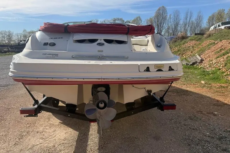 Slide: The Image of Rear view of a 2005 Sea Ray 220 Sundeck boat on a trailer. - 6