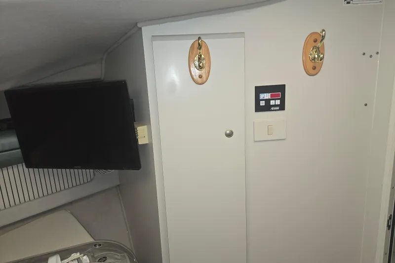 Slide: The Image of Interior of 1994 Cruisers Yachts 3380 Esprit with TV and control panel. - 13