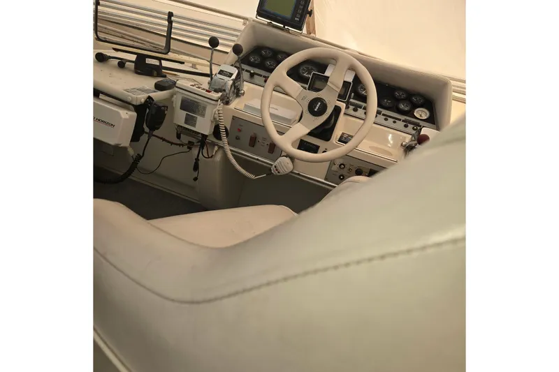 Slide: The Image of Interior helm of 1994 Cruisers Yachts 3380 Esprit with steering wheel and controls. - 15