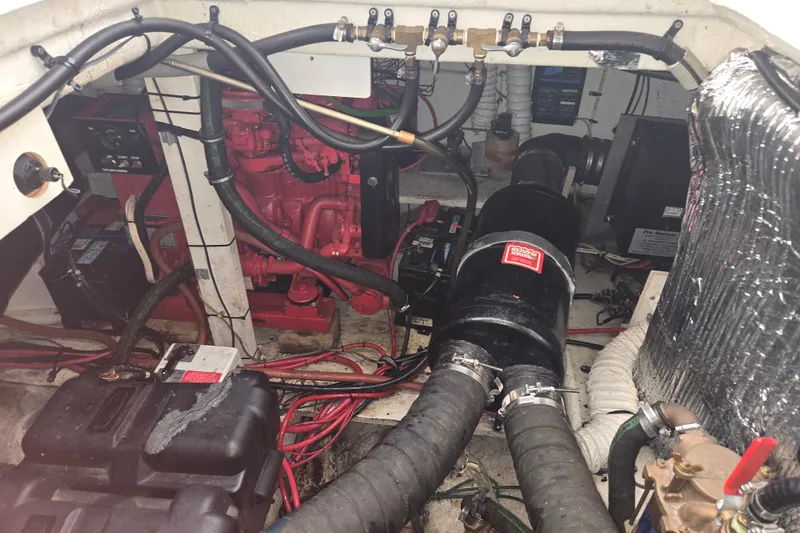 Slide: The Image of Engine compartment of 1994 Cruisers Yachts 3380 Esprit with visible wiring and components. - 16