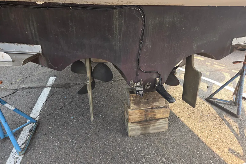 Slide: The Image of 1994 Cruisers Yachts 3380 Esprit propeller and rudder on dry dock. - 17